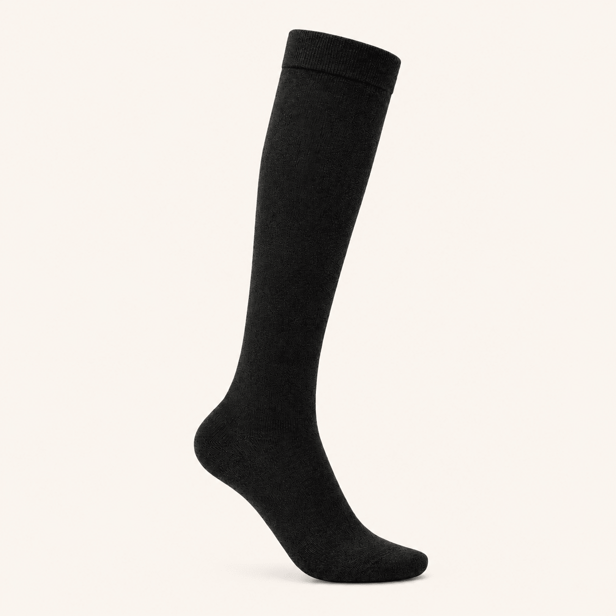 Black knee-high alpaca compression socks laid flat
